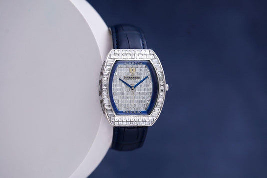 Luxury watch with diamond-studded case on a dark background