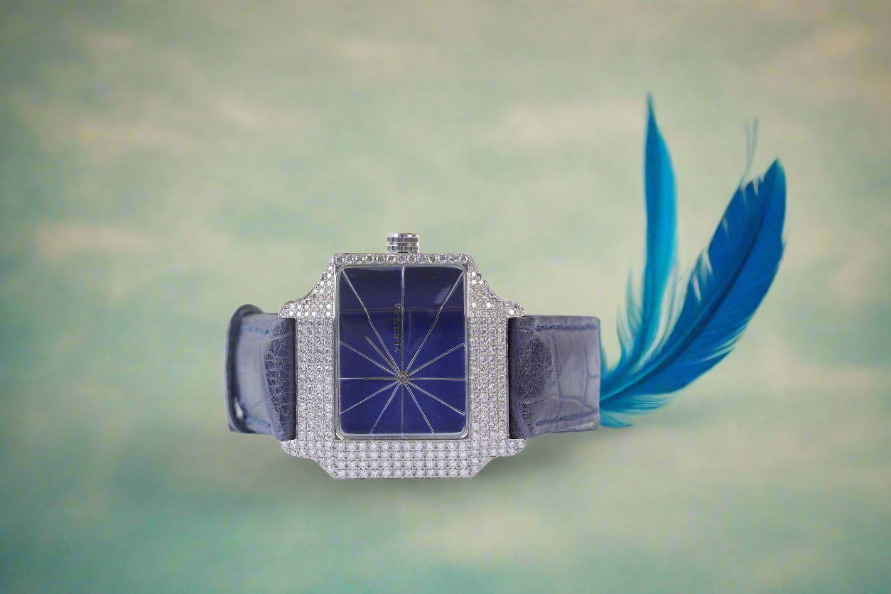 Luxury watch with blue face and strap on a white background