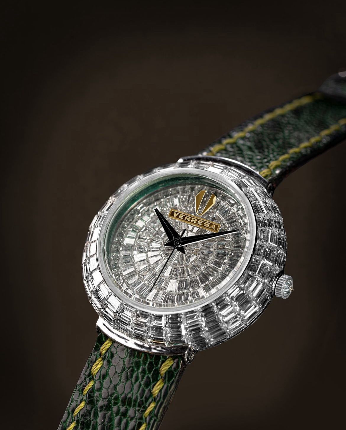 Luxury watch with diamond-encrusted face and green strap on a dark background