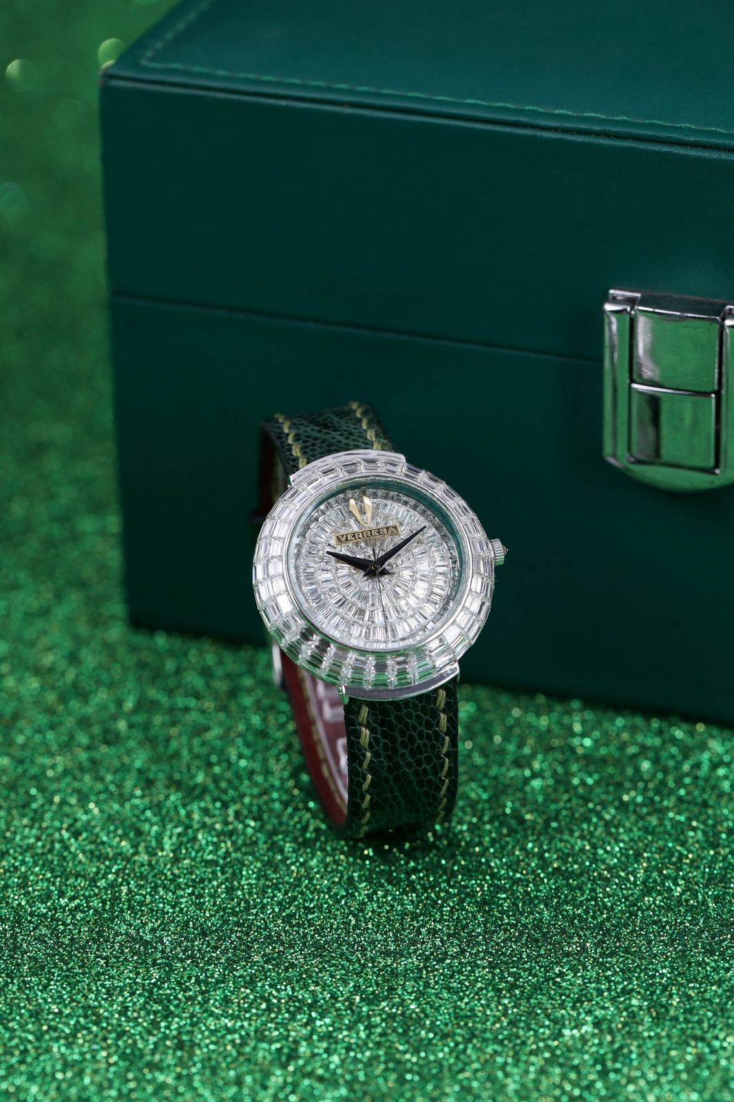 Luxury watch with a green glittery background